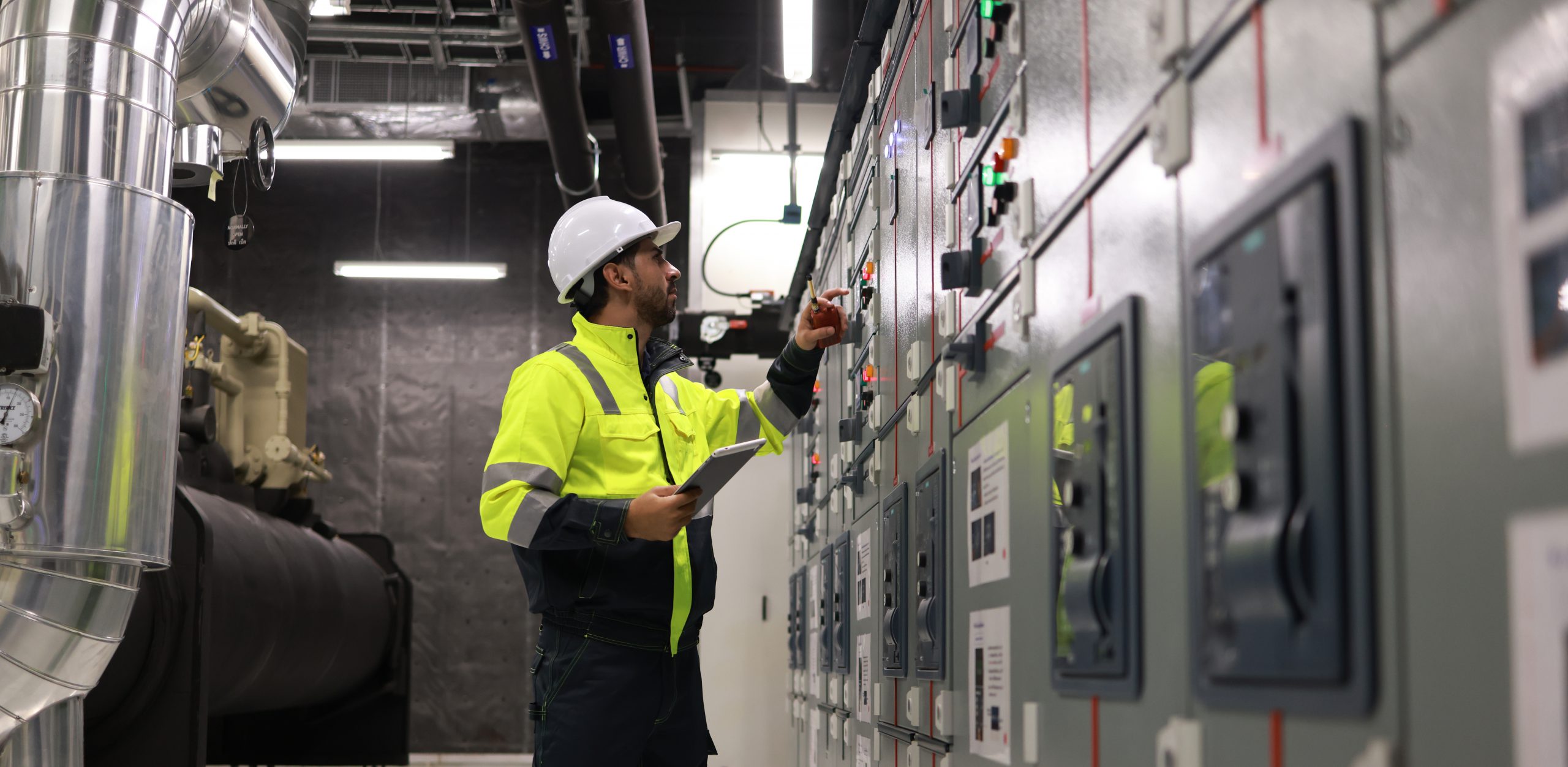 Engineer inspecting switchgear panels